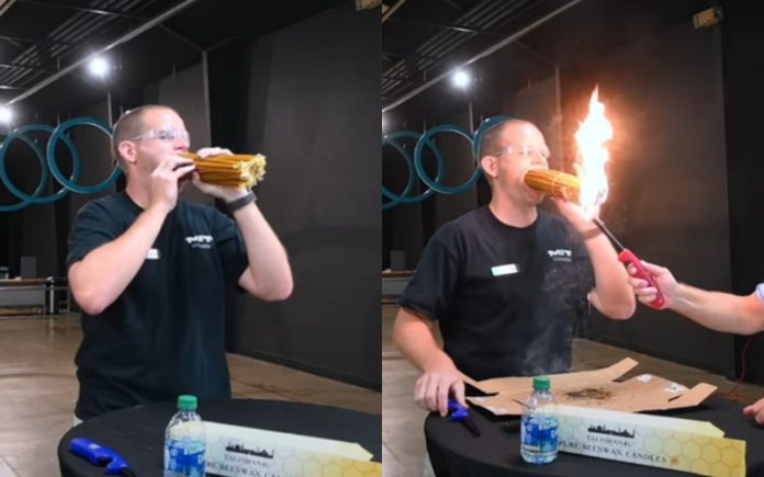 Homem segura 150 velas acesas na boca para o Guinness World Record