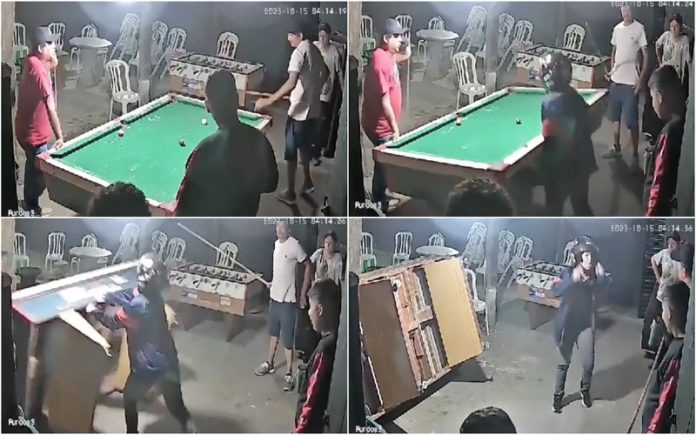 Mulher parte mesa de bilhar e interrompe o jogo do marido