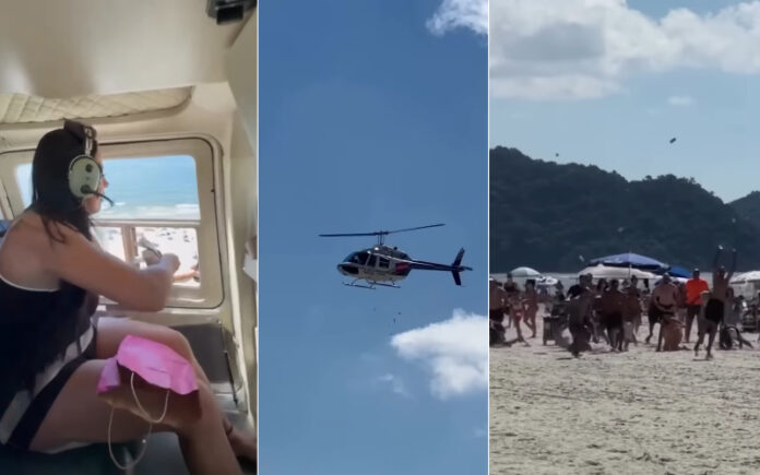 Influenciadora provoca alvoroço na praia com chuva de dinheiro.