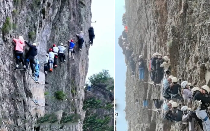 Alpinistas chineses ficam retidos num penhasco por mais de uma hora devido ao excesso de turistas Alpinistas chineses ficam retidos num penhasco por mais de uma hora devido ao excesso de turistas