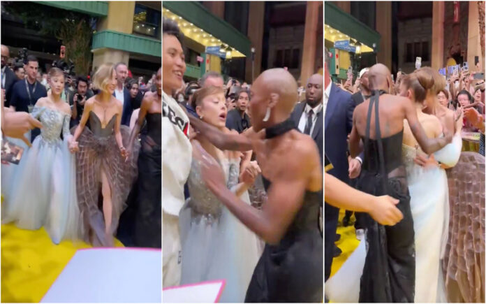 Influencer australiano arrisca multa após invadir red carpet e agarrar Ariana Grande