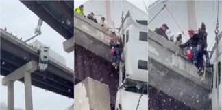 Camião fica suspenso em ponte durante nevão e motorista é salvo por equipas de resgate