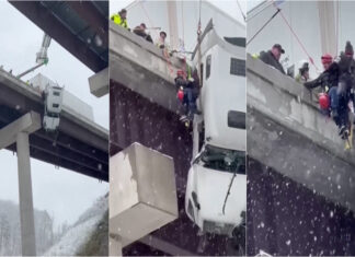 Camião fica suspenso em ponte durante nevão e motorista é salvo por equipas de resgate