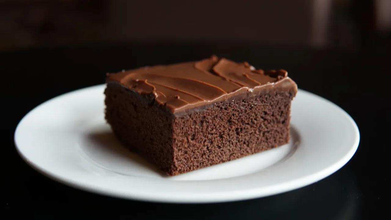 Illustrative photograph. It does not confirm the identity of any person mentioned in the article. Close-up of a chocolate brownie slice on a white plate, perfect for dessert lovers.